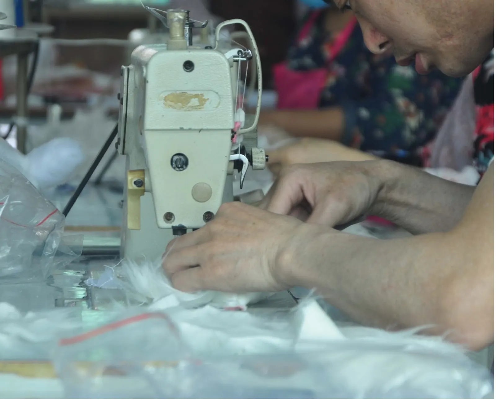 DragonMoss artist sewing a custom pet plush by hand